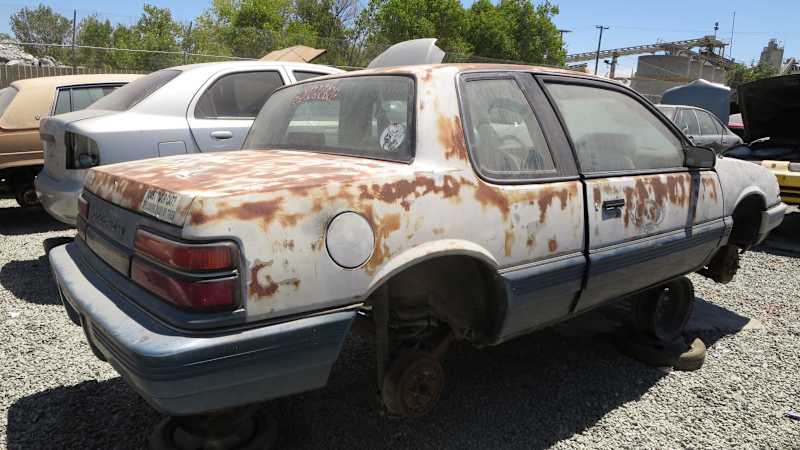 11+-+1991+Pontiac+Grand+Am+in+California+Junkyard+-+Photo+by+Murilee+Martin.jpg